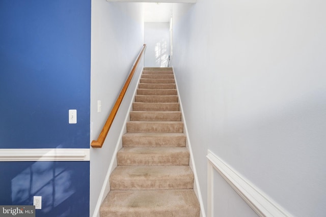 stairway with carpet floors