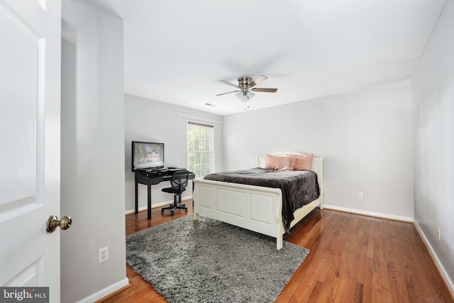 bedroom with hardwood / wood-style flooring and ceiling fan