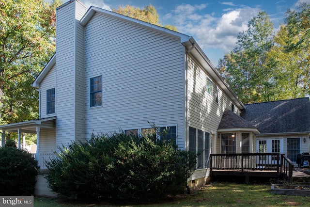 view of property exterior with a deck