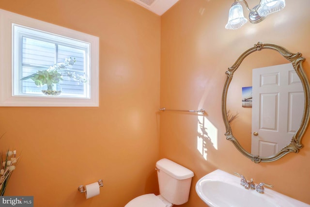 bathroom with sink and toilet