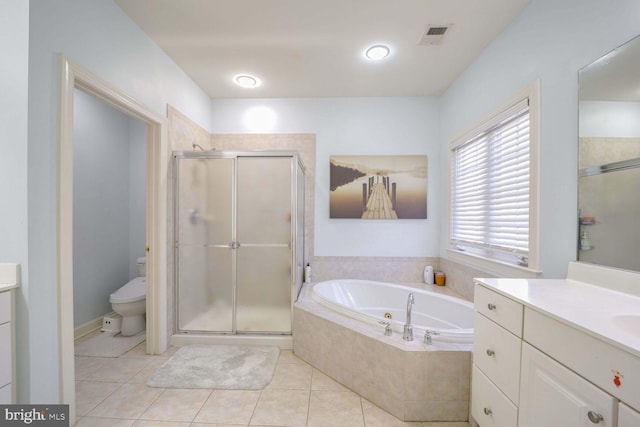 full bathroom with toilet, shower with separate bathtub, vanity, and tile patterned floors