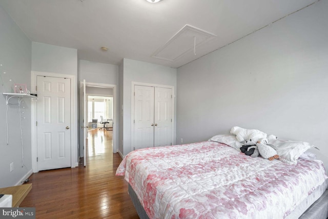 bedroom featuring dark hardwood / wood-style flooring