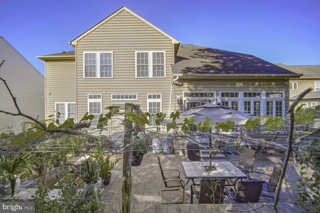 back of house with a patio area