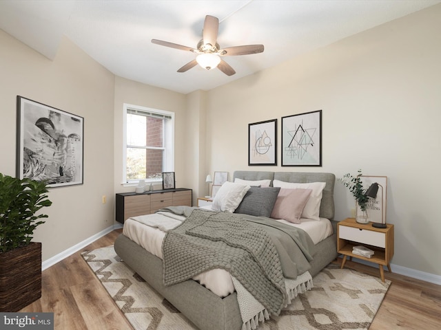 bedroom with ceiling fan and light wood-type flooring