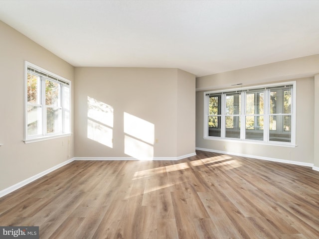 spare room featuring light hardwood / wood-style floors