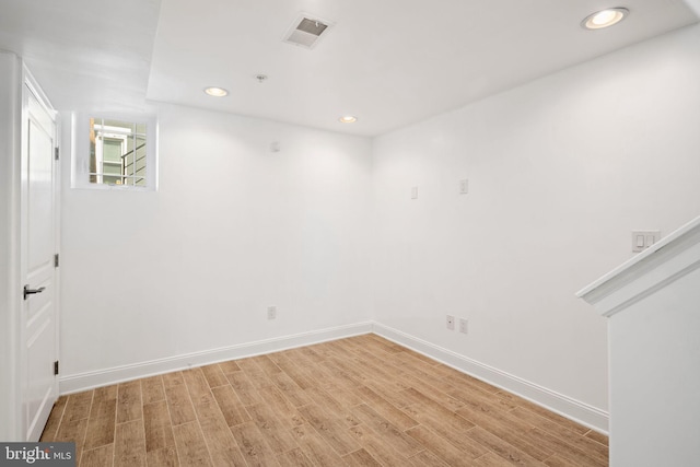 spare room with hardwood / wood-style floors