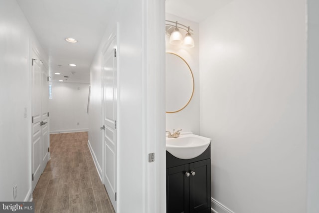 bathroom with wood-type flooring and vanity