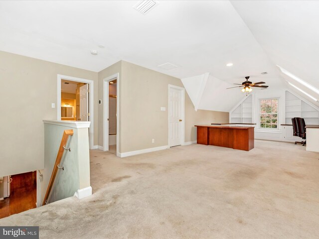 additional living space featuring lofted ceiling, ceiling fan, and light colored carpet