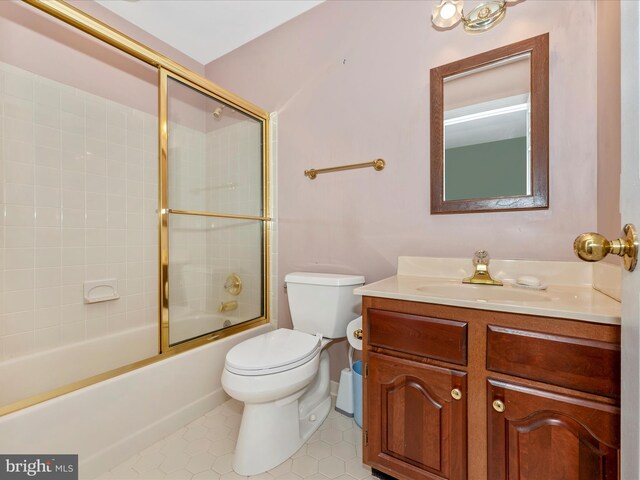 full bathroom featuring shower / bath combination with glass door, vanity, and toilet