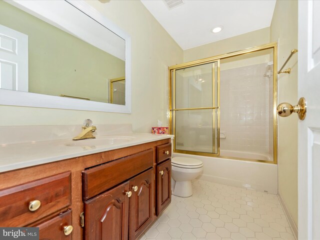 full bathroom with tile patterned floors, vanity, toilet, and combined bath / shower with glass door