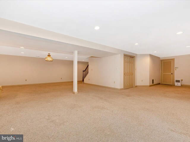 basement with light colored carpet