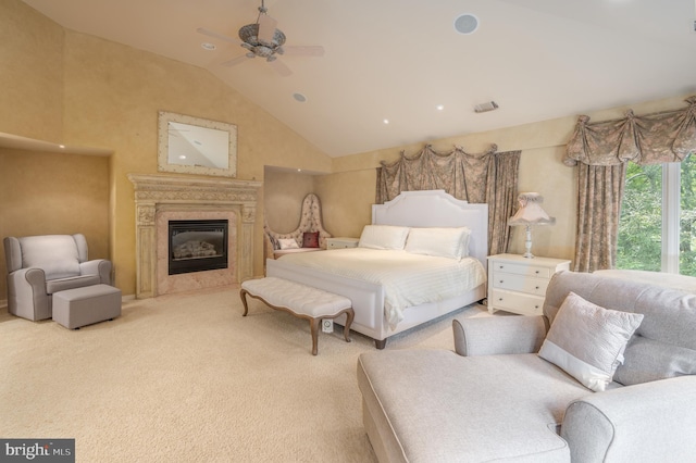 carpeted bedroom with high vaulted ceiling and ceiling fan