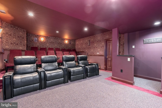 cinema room with light colored carpet