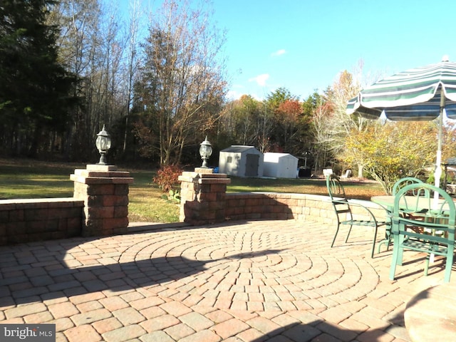 view of patio / terrace with a storage shed