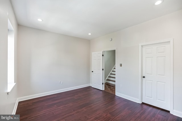 spare room featuring dark hardwood / wood-style floors