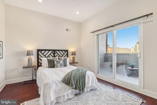 bedroom with dark wood-type flooring and access to exterior