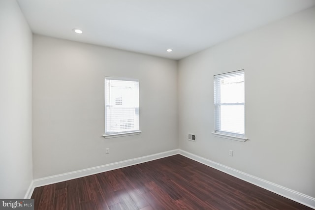 unfurnished room featuring hardwood / wood-style flooring