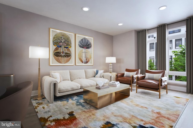 living area with baseboards, recessed lighting, and wood finished floors