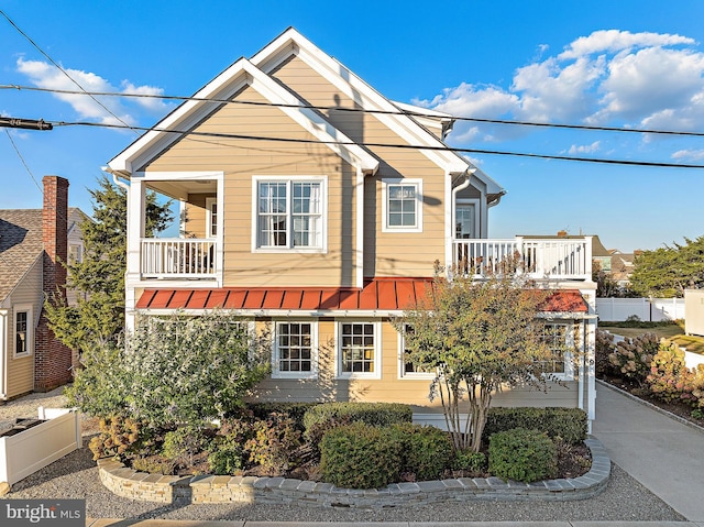 view of front of house featuring a balcony