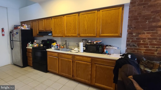 kitchen featuring sink and black appliances