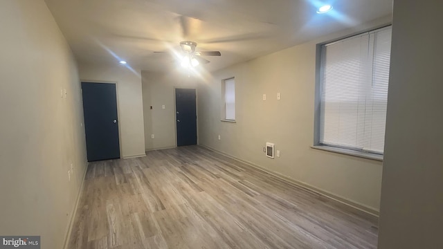 unfurnished room featuring ceiling fan and light hardwood / wood-style flooring