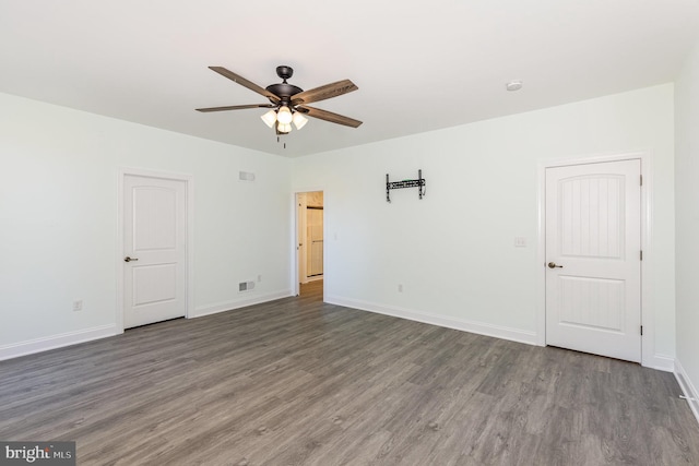 unfurnished room featuring dark hardwood / wood-style floors and ceiling fan