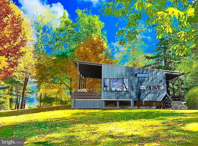 view of outbuilding featuring a lawn