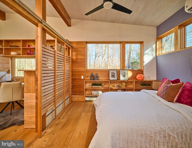 bedroom featuring light wood-type flooring, wooden walls, a wall unit AC, and wooden ceiling