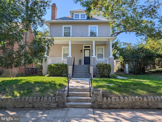 view of front of home with a front lawn and a porch