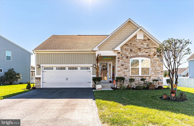 craftsman house featuring a garage and a front yard