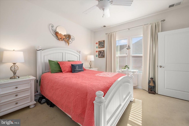 bedroom featuring light colored carpet and ceiling fan