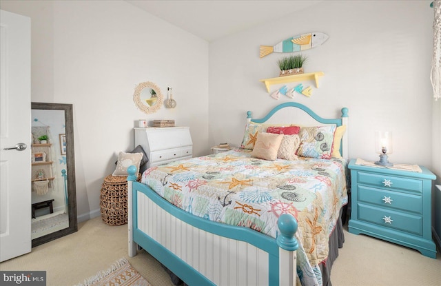 bedroom featuring light carpet