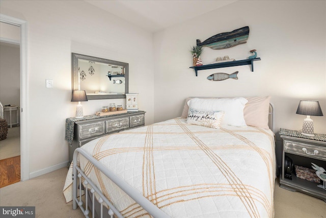 bedroom featuring light colored carpet