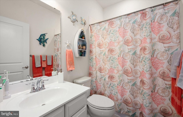 bathroom with vanity, toilet, and a shower with shower curtain