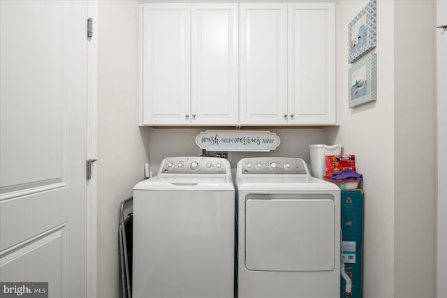 36865 Herring Way, Selbyville, DE 19975 - washroom featuring washing machine and dryer and cabinet space