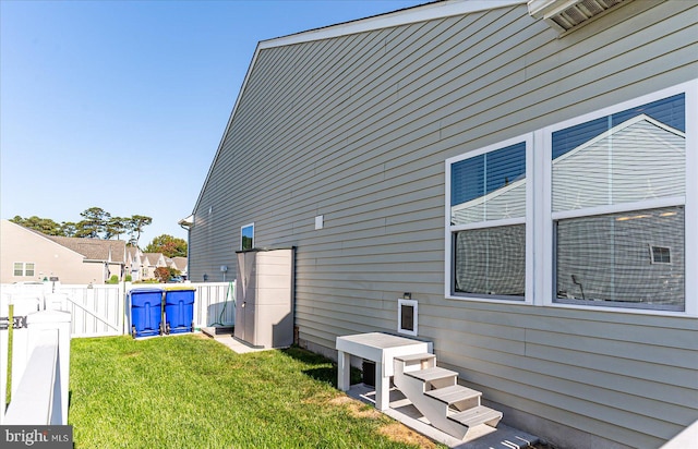 view of home's exterior with a yard