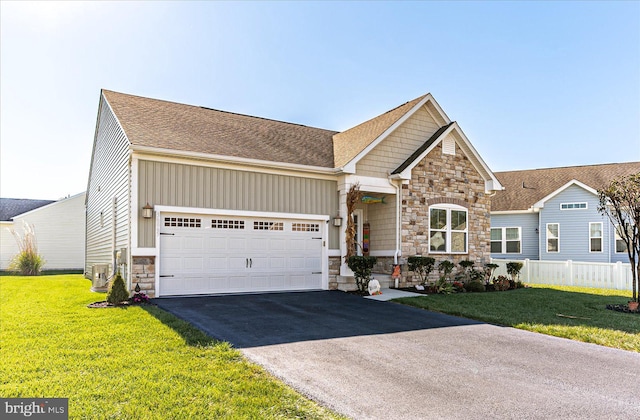 view of front of home featuring a front lawn and a garage