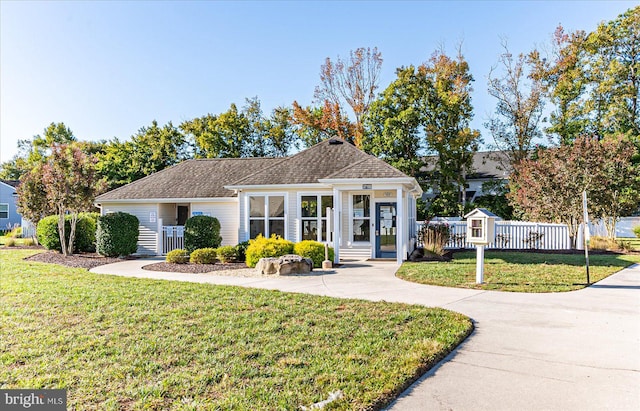 view of front of house featuring a front lawn and covered porch