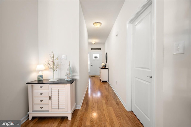 hall with light hardwood / wood-style flooring