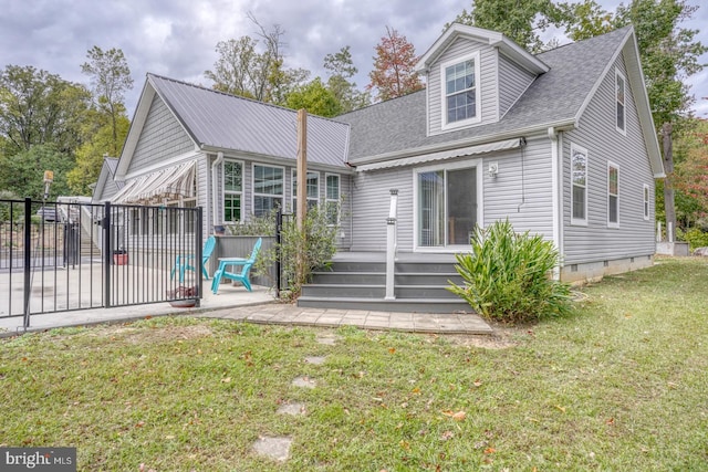 back of property featuring a patio and a lawn