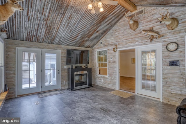 unfurnished living room featuring wood ceiling, ceiling fan, high vaulted ceiling, beamed ceiling, and french doors