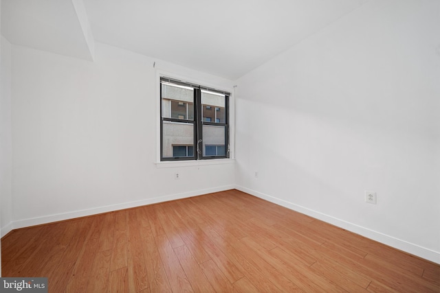 empty room with light wood-type flooring