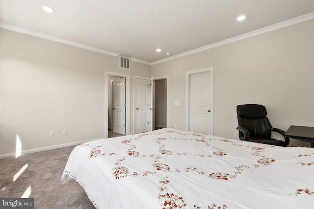 bedroom with crown molding and carpet floors