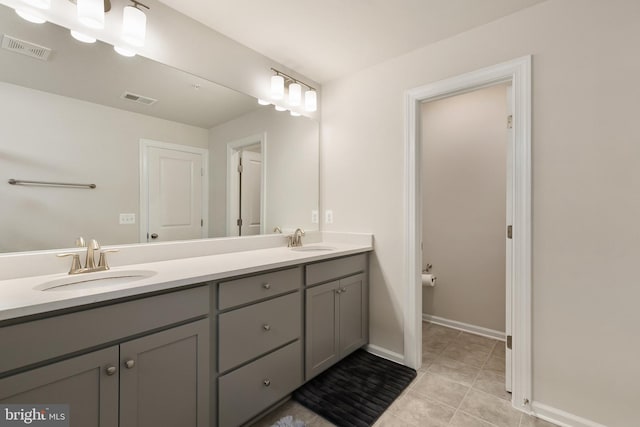 bathroom featuring vanity and tile patterned flooring