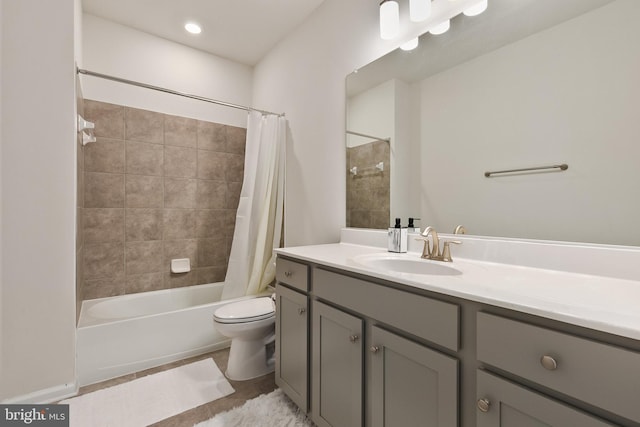 full bathroom with vanity, shower / tub combo with curtain, and toilet