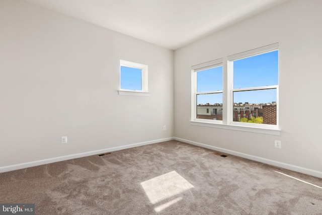 spare room with light colored carpet