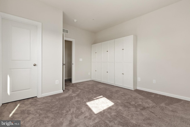 unfurnished bedroom featuring carpet