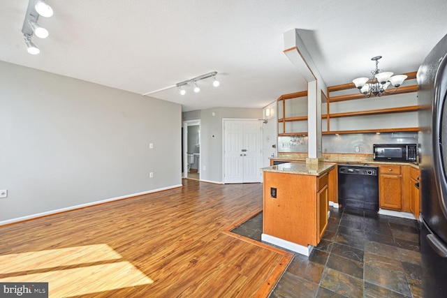 kitchen featuring track lighting, a textured ceiling, a chandelier, black appliances, and dark wood-type flooring