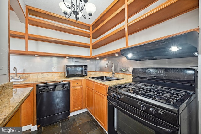 kitchen with an inviting chandelier, black appliances, sink, and light stone counters