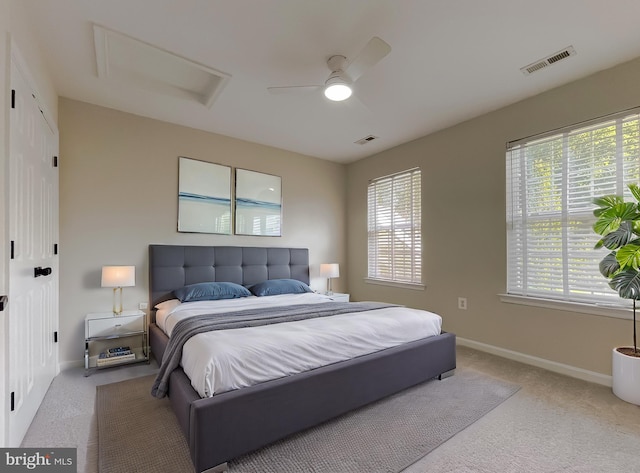 carpeted bedroom featuring a closet and ceiling fan